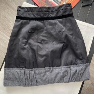 Size XS | Black Mini Skirt  In excellent Pre-owned condition. Gently used.   App